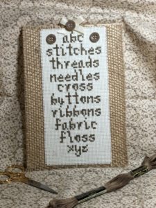 cross stitcher's sampler in brown thread